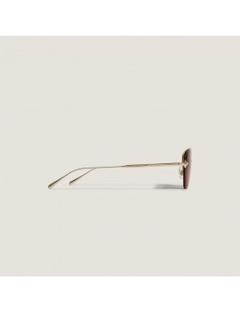 Lunettes de soleil ovales à monture métallique dorée